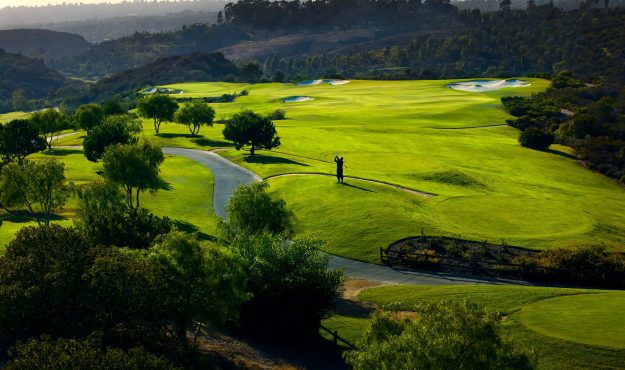 Man teeing off at The Grand Del Mar golf course